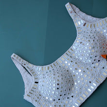 Sleeveless white mirror work blouse with broad U neck
