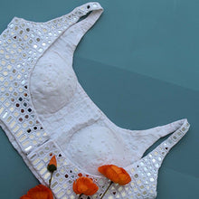 Side detail of handcrafted white mirror work saree blouse
