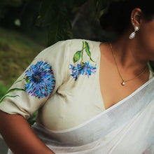 Close-up of hand-painted aster floral artwork on tussar silk