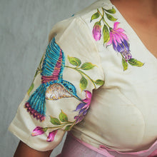 Close-up of hand-painted hummingbird artwork on tussar silk
