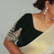 Bottle green velvet zardozi blouse styled for festive wear