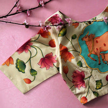 Close-up of hand-painted Pichwai jaal artwork on beige tussar silk